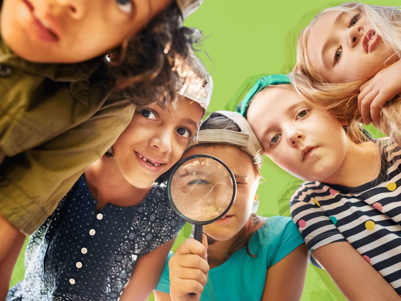 Five children are looking down at the camera, with one holding and peering through a magnifying glass. The background is a solid green color, symbolizing the fresh perspectives brought by youth entrepreneurship education.