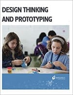 Two students engaged in a free entrepreneurship curriculum, focusing on assembling components at a table.