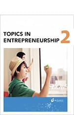 Cover of a textbook titled "Topics in Entrepreneurship 2 " featuring a young woman in a classroom, writing on a whiteboard.