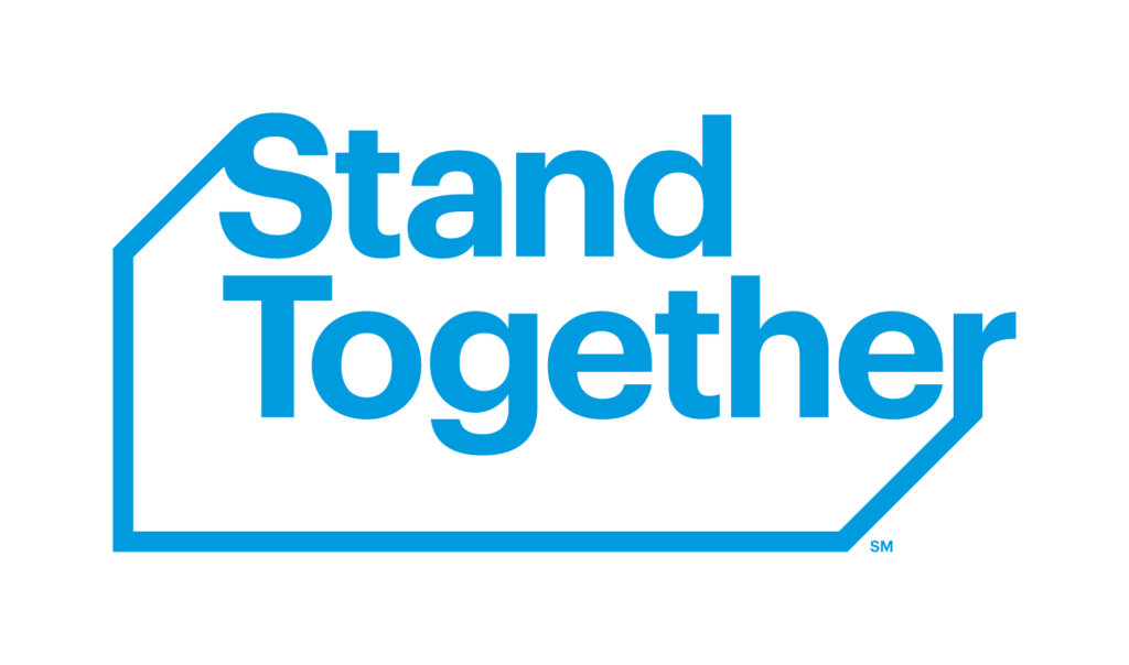 Blue text reads "Stand Together" enclosed within an angular frame on a white background, reflecting the ethos of entrepreneur education.