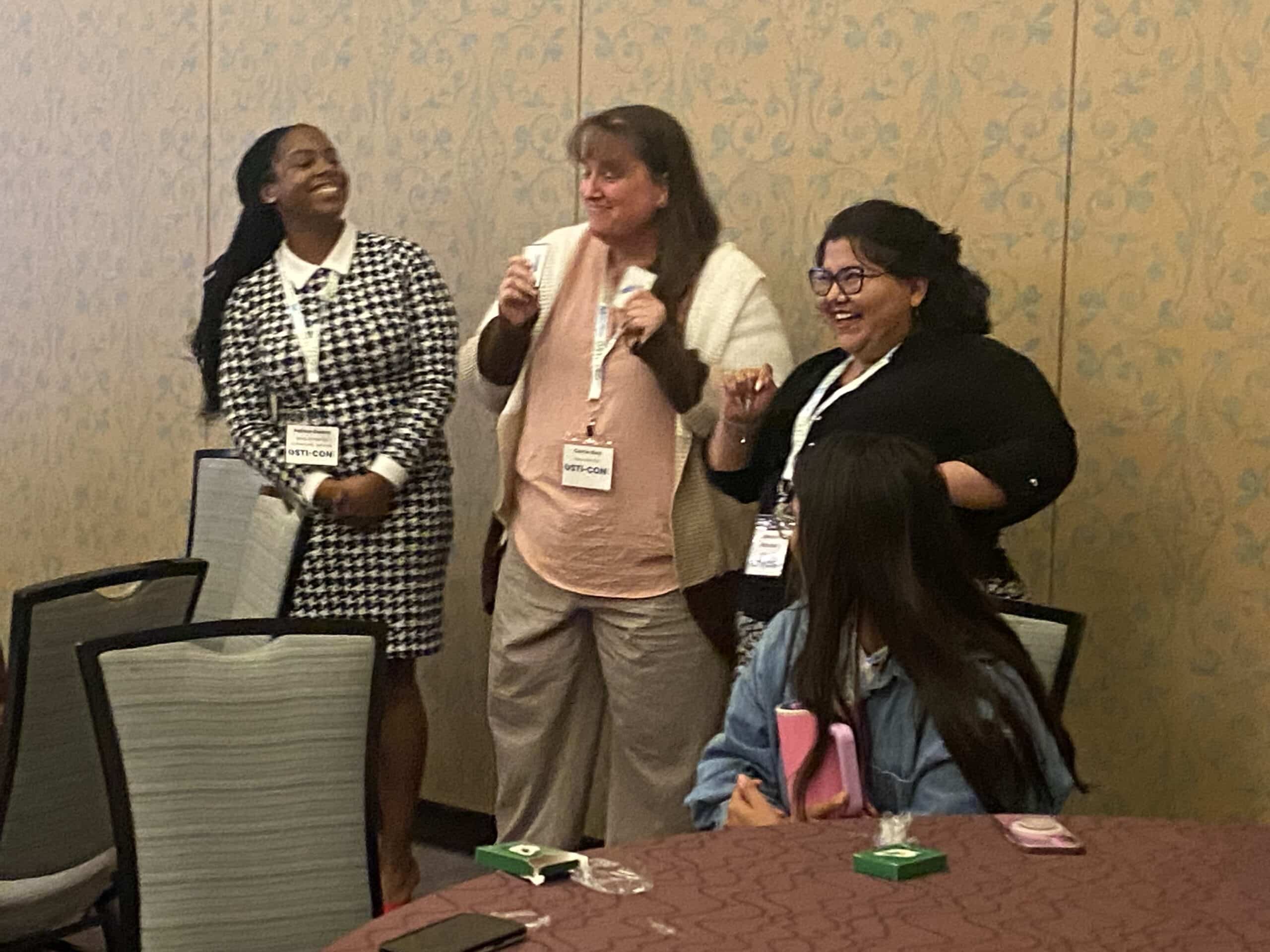 attendees participating in a session at the OSTI-CON 2025 conference