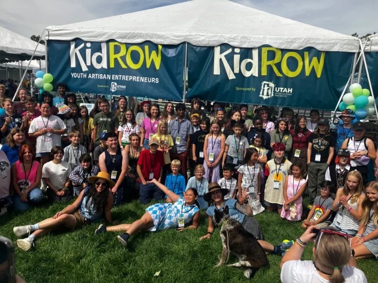 a group of participants at a "Kid Row" event. This program is an initiative aimed at empowering young artisan entrepreneurs to develop their creativity and business skills