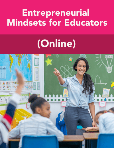 A teacher smiles as she gives a lesson to her students