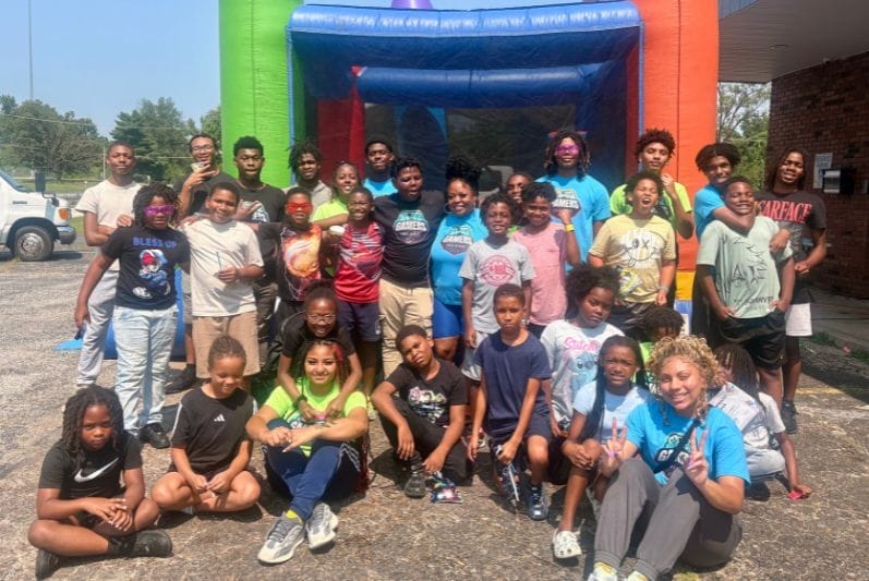 Group of kids near bouncy house St Louis New Avenue