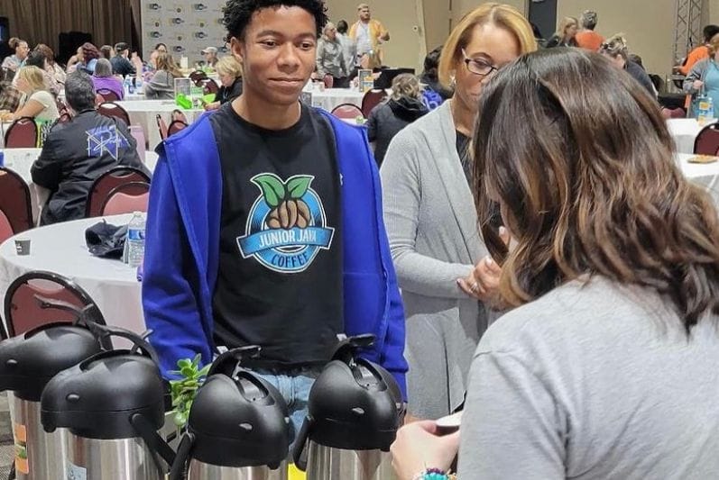 Student with his coffee product