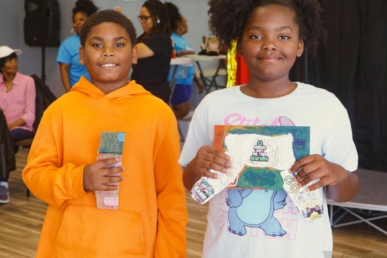 young students displaying their prototypes